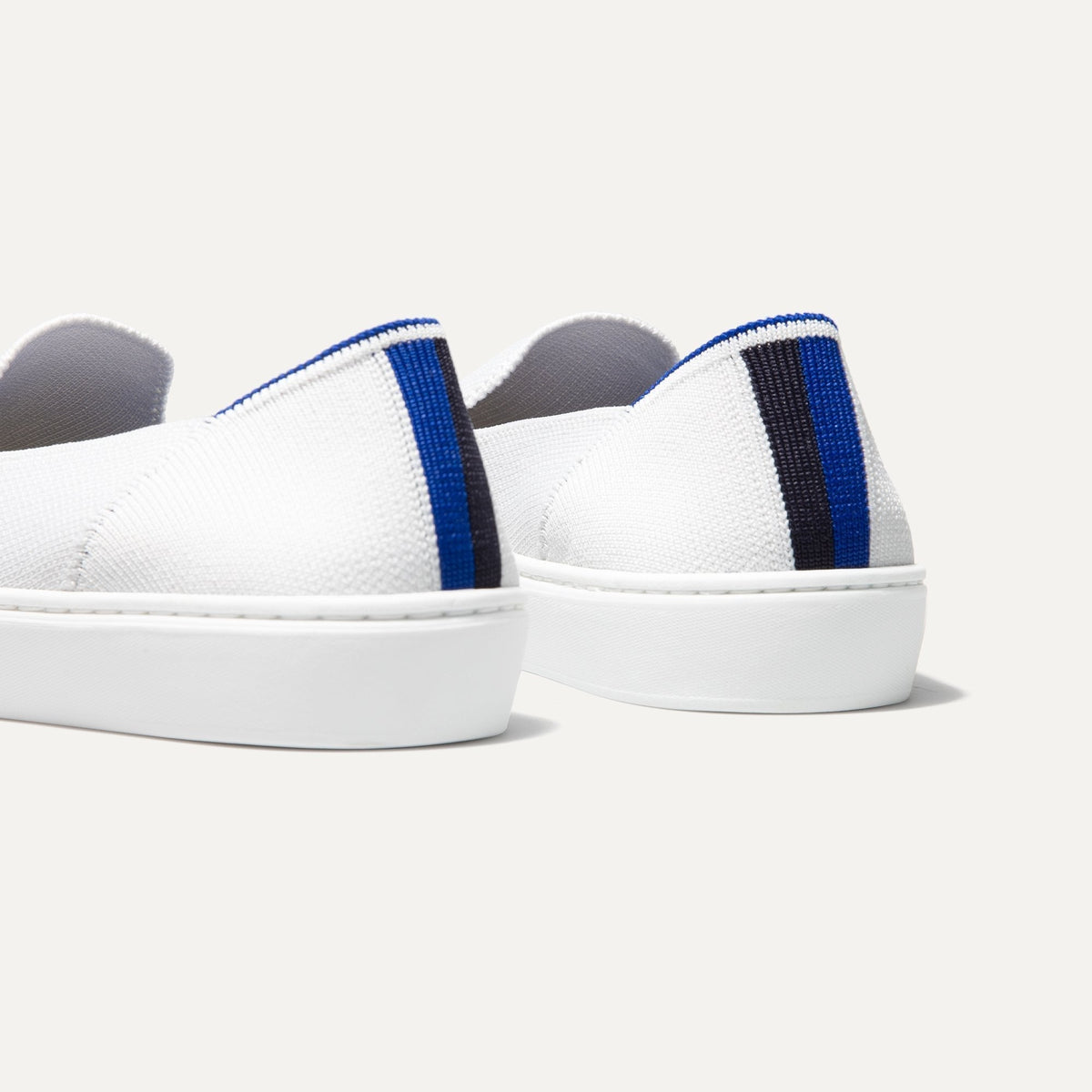 The slip-on Sneaker in Bright White shown from the back view with the heel detail.
