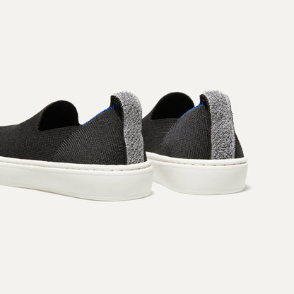 The Kids slip-on Sneaker in Black shown from the back view with the heel detail.