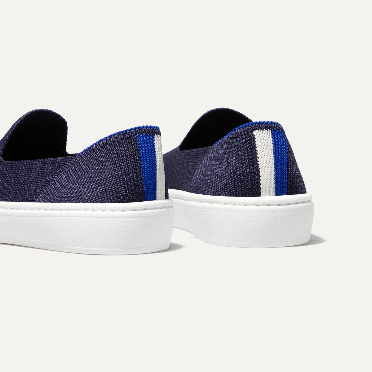 hover | The Kids slip-on Sneaker in Deep Navy shown from the back view with the heel detail.