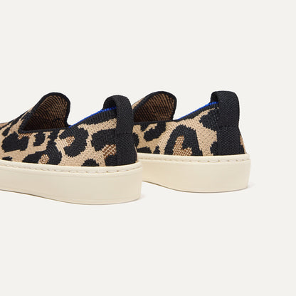 Close up of the heel of The Kids Sneaker in Desert Cat, with shimmery gold pull tab.