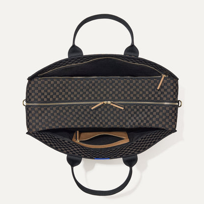 The Weekender in Night Song shown from the top with zipper side compartment and magnetic side compartment open.