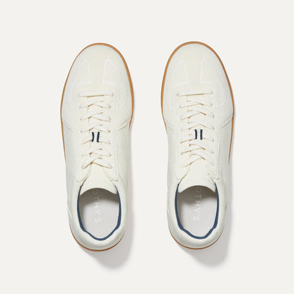 A pair of The RS01 Sneaker in Bone shown from the top.