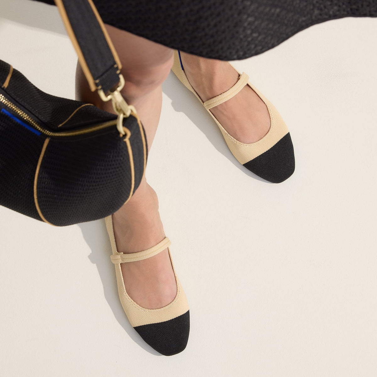 hover | Model wearing The Square Mary Jane in Cream Captoe.