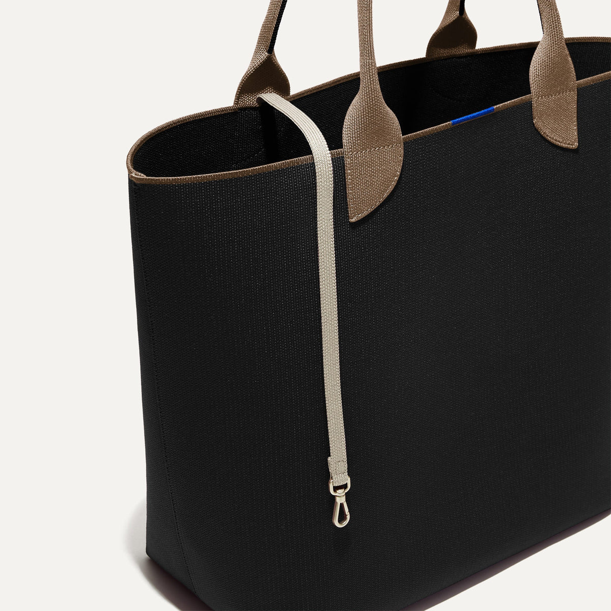 The Lightweight Tote in Black Portobello shown with its handy key leash.