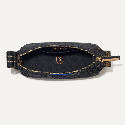 The Casual Crossbody in Night Song, shown from above, with the interior exposed.