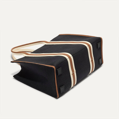 The Classic Tote in Black Coffee, shown from the bottom.