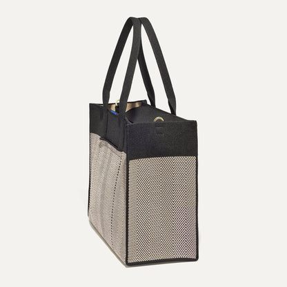 The Classic Tote in Black Herringbone, shown from the side.