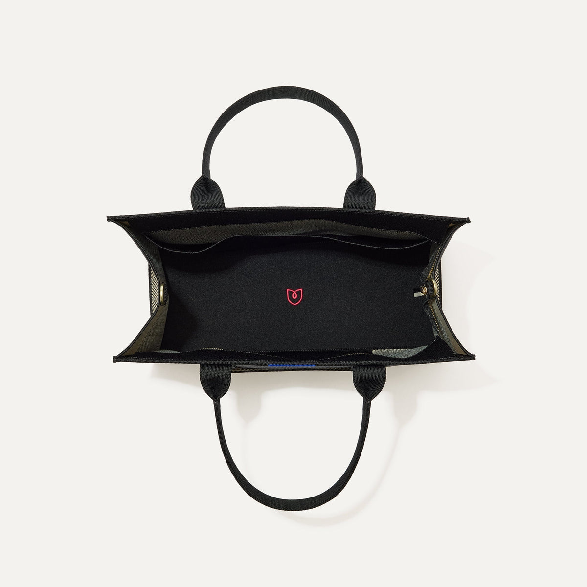 The Classic Tote in Black Herringbone, shown from above, with the interior exposed.