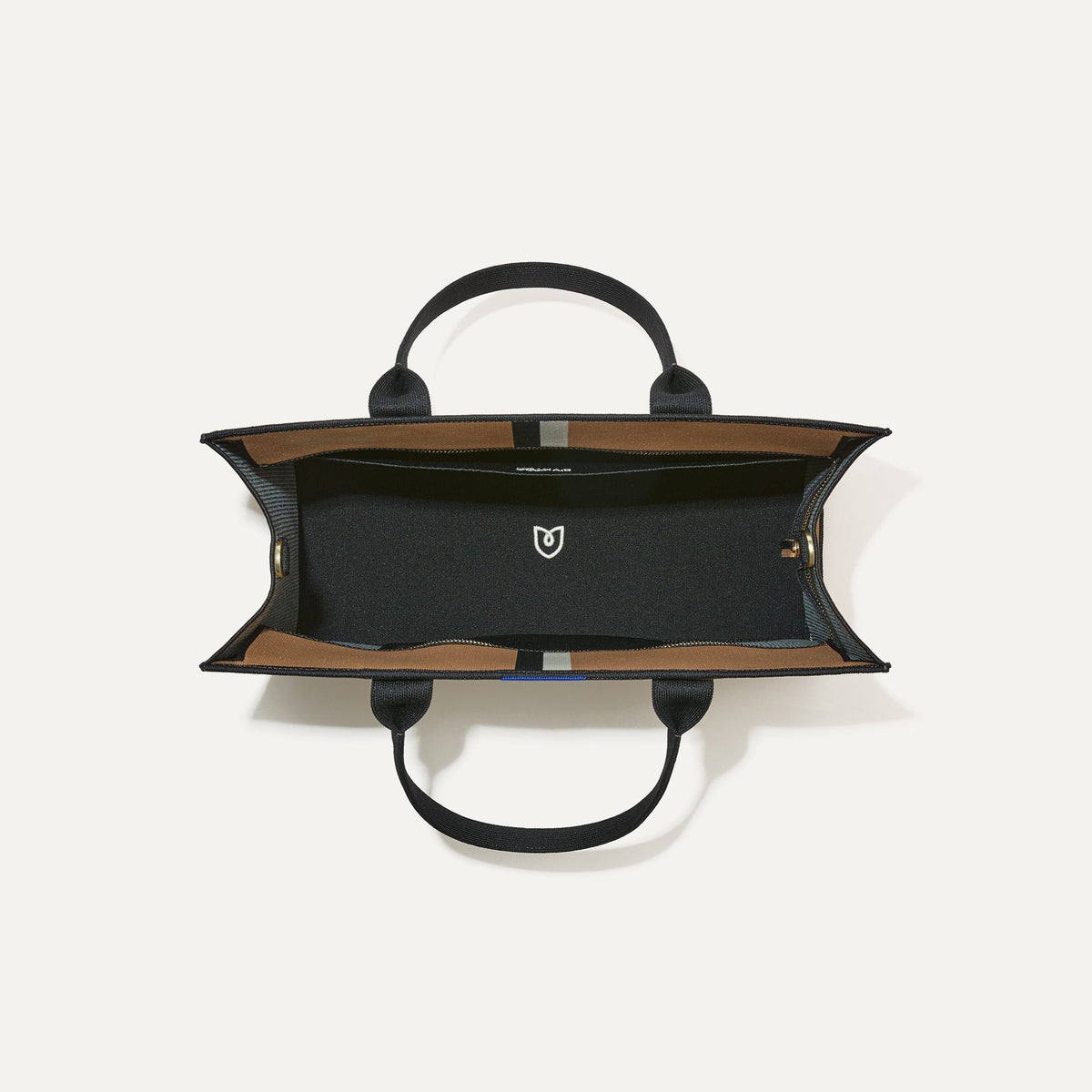 The Classic Tote in Grand Piano, shown from above, with the interior exposed.