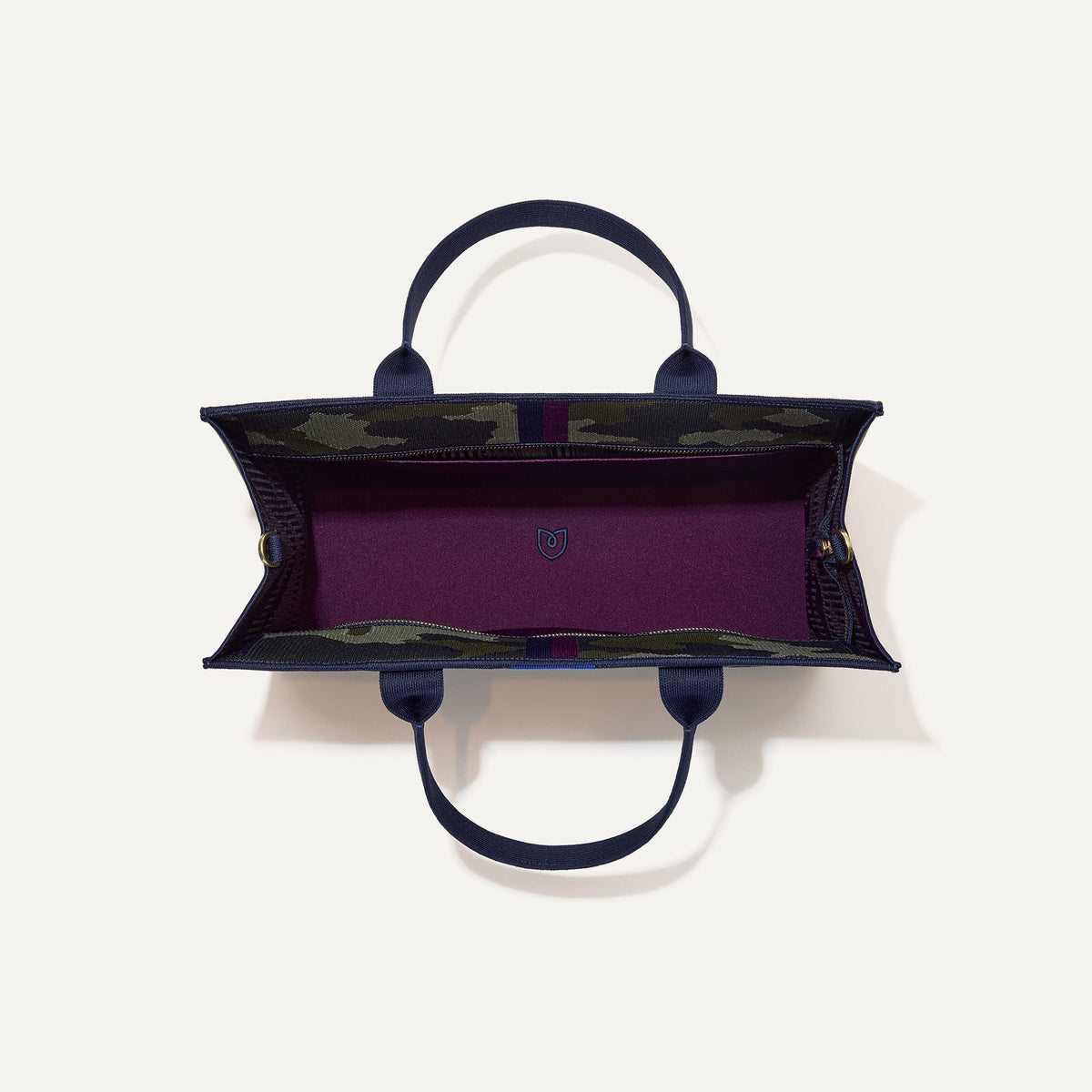 The Classic Tote in Spruce Camo, shown from above, with the interior exposed.