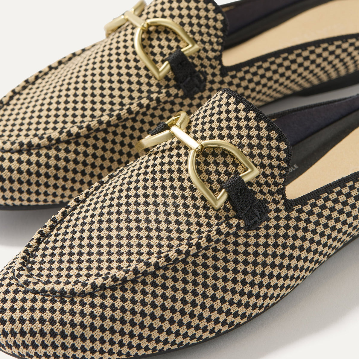 Close up of the toe and hardware of The Double Bit Loafer Mule in Classic Micro Check.