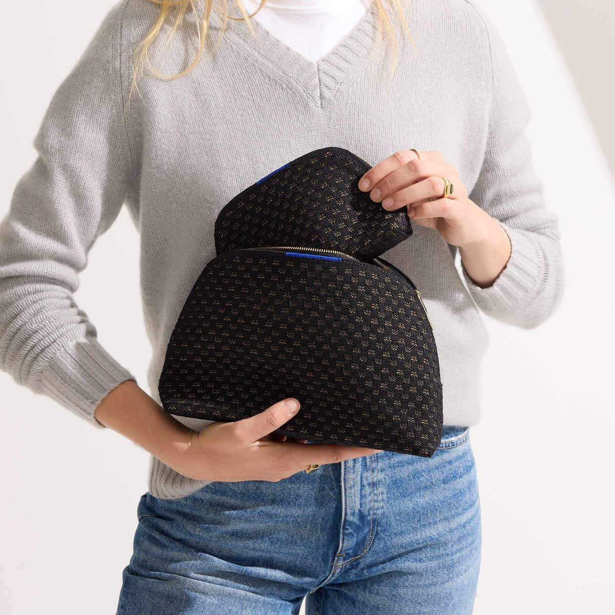 hover | Model shown holding the large and small pouch of The Vanity Set in Night Song.