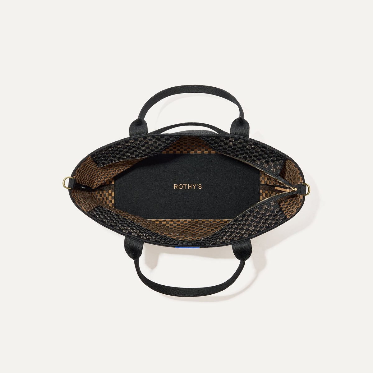 The Zip Travel Tote, shown from above with the interior exposed.
