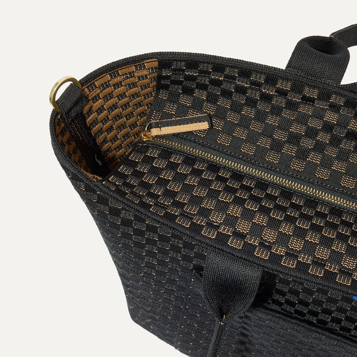 A close up of The Zip Travel Tote in Night Song focusing on the zip closure and handles.