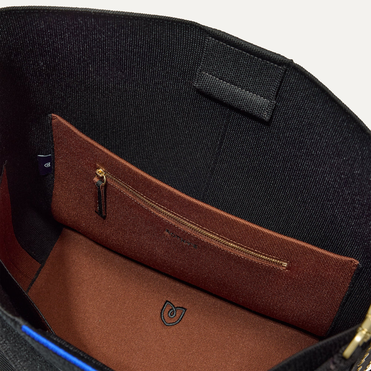 The Bucket Bag in ReVelvet™ Black close up of interior zipper pocket.