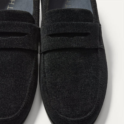 Close up of the vamp and penny keeper detail on The Ravello Penny Loafer in ReVelvet™ Black.