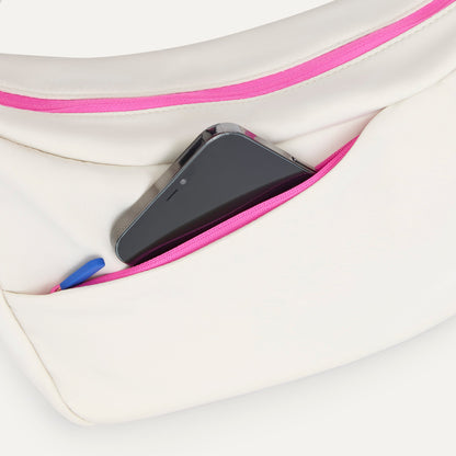 The Travel Sling in Optic shown closed from the top showcasing the side pocket.