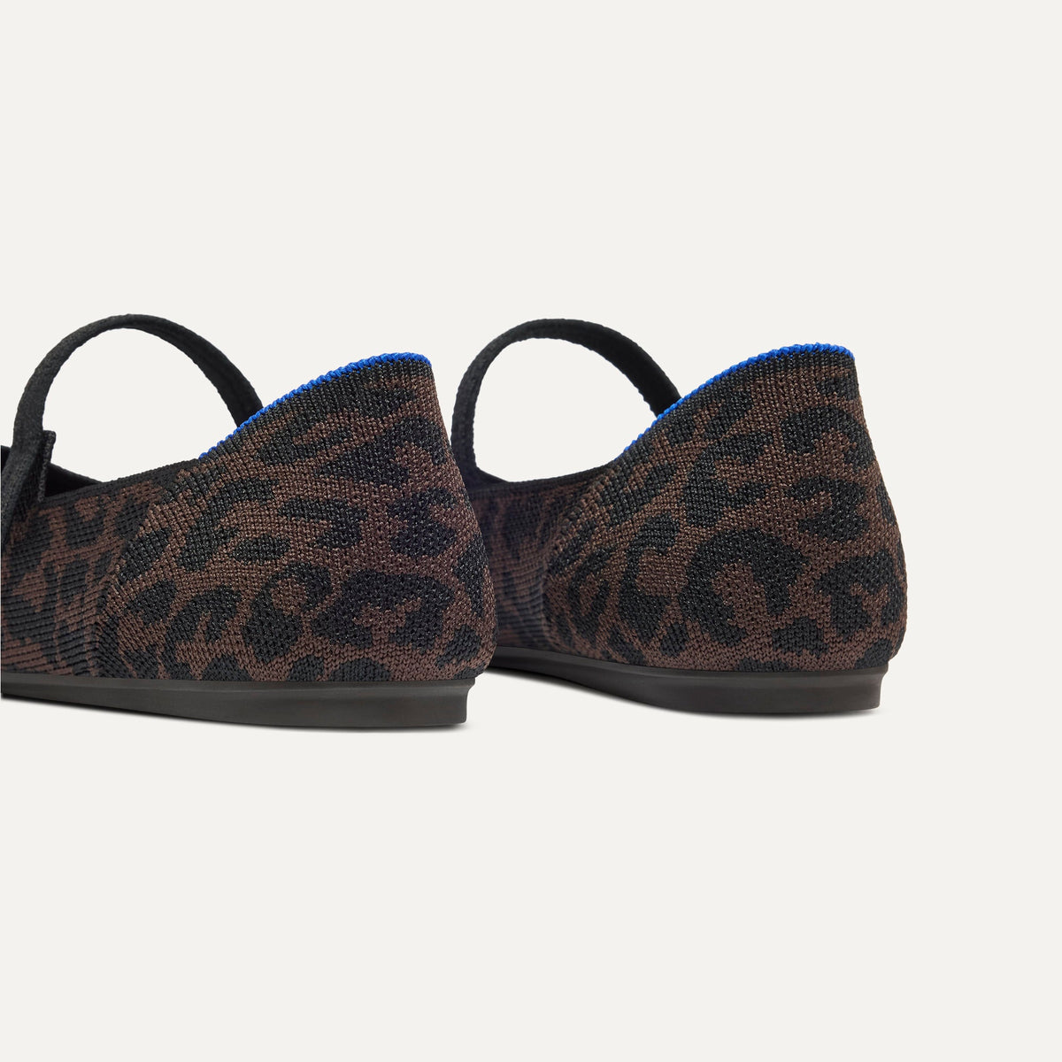 Close up of the heel of The Square Mary Jane in Classic Cheetah, with Rothy's signature blue halo.