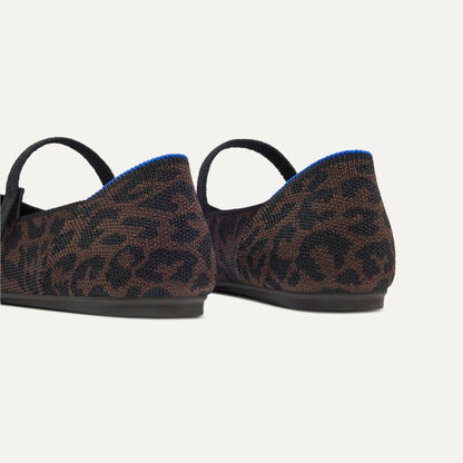 Close up of the heel of The Square Mary Jane in Classic Cheetah, with Rothy's signature blue halo.